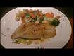 "Orange Roughy"-Seared orange roughy covered in a champagne lemon grass sauce. Served over(..)